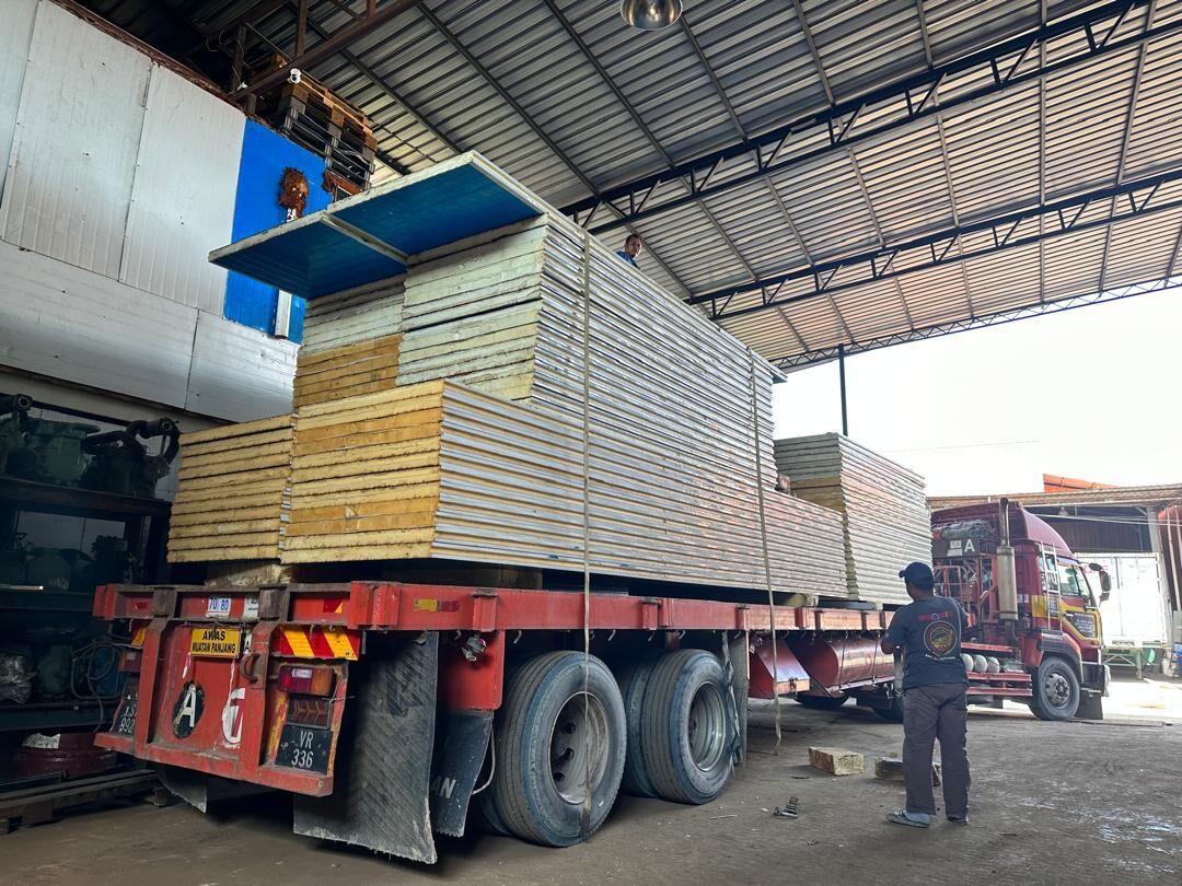 Stack of insulated panels loaded onto a lorry